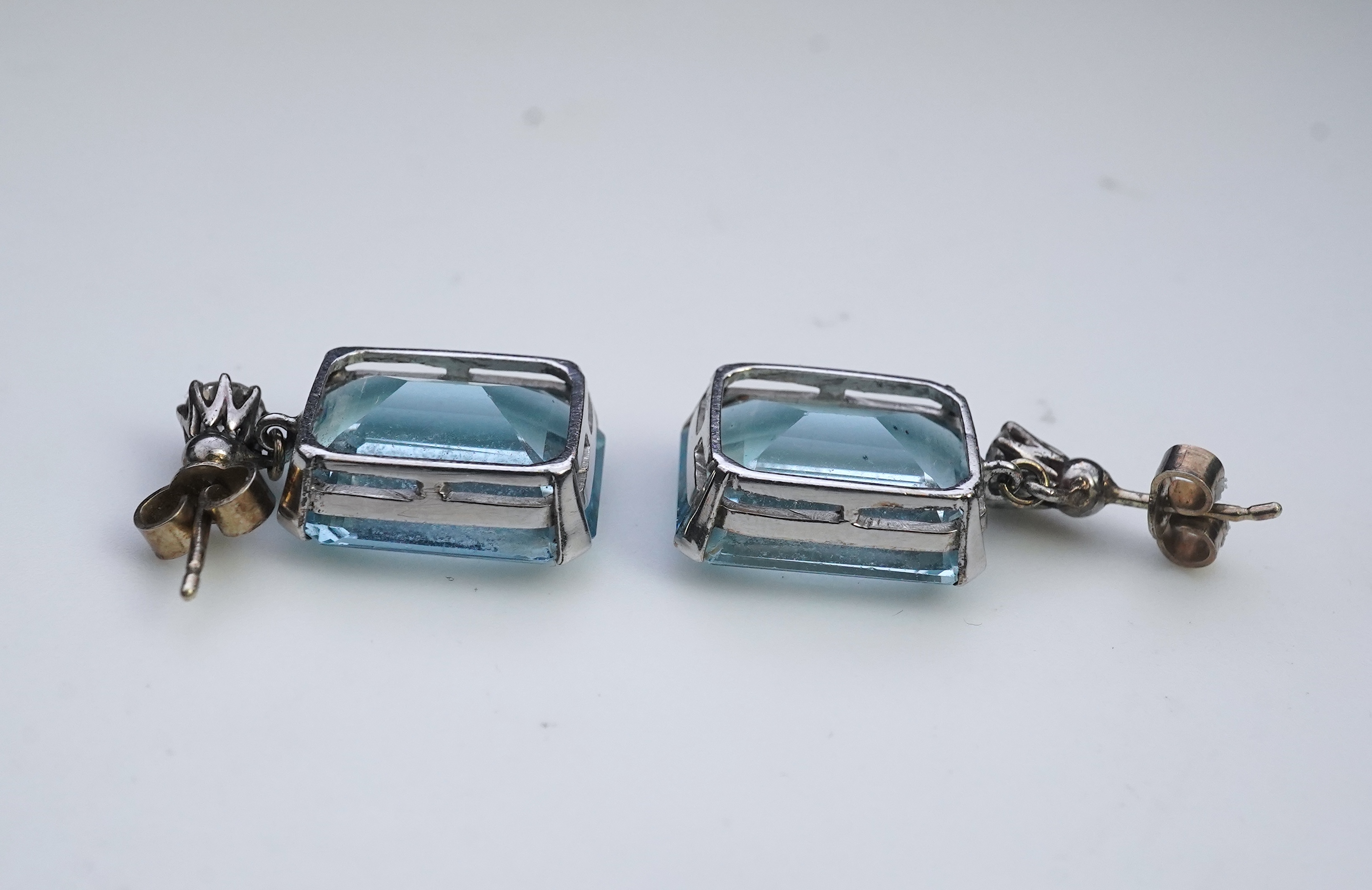 A pair of aquamarine and diamond earrings